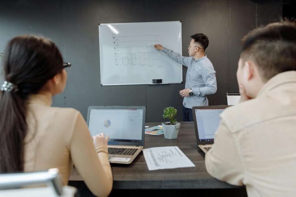 Business team discussing project strategy during a meeting in a modern office.